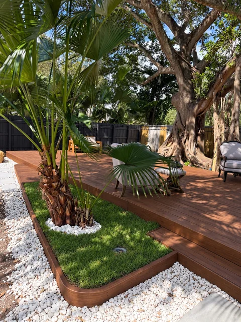 Custom wood deck surrounding an integrated tropical garden