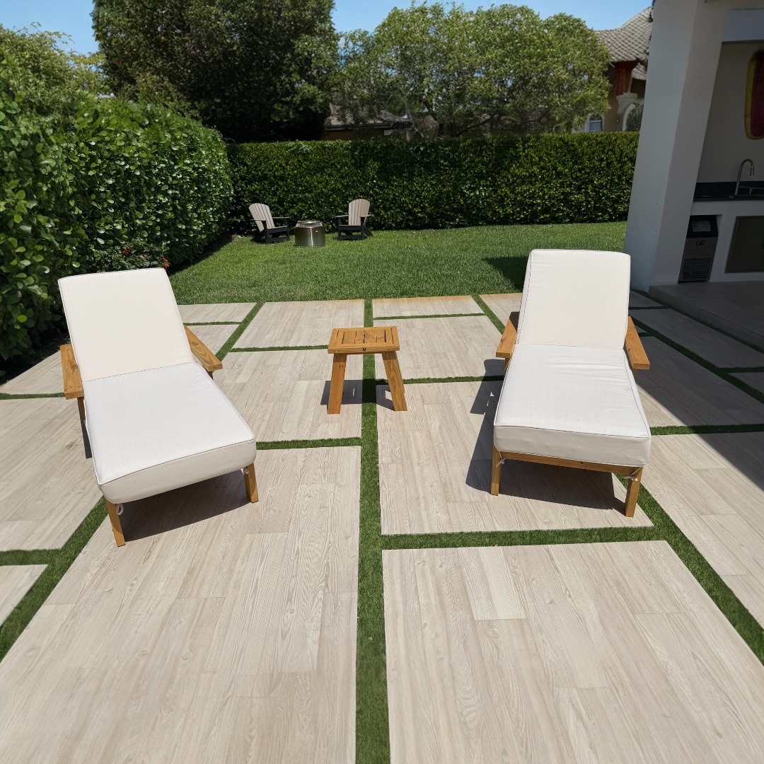 Sol loungers on a tiled garden patio