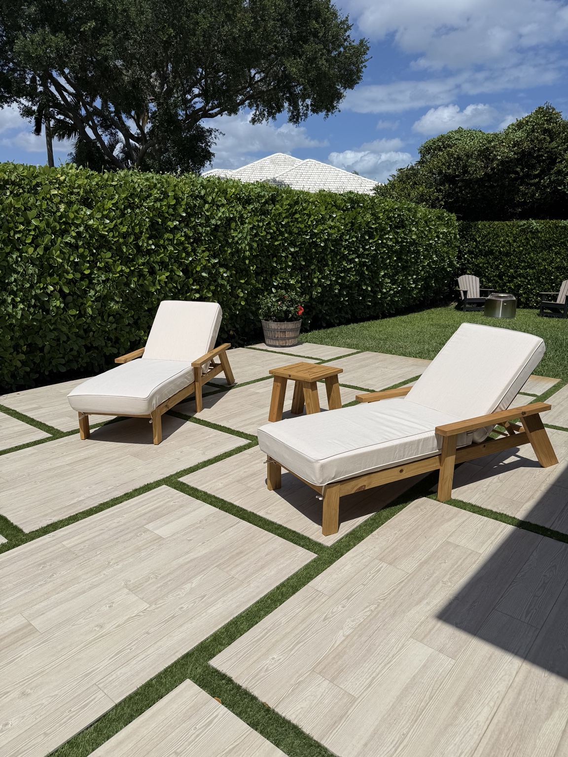 Sol loungers with a side table on a garden terrace