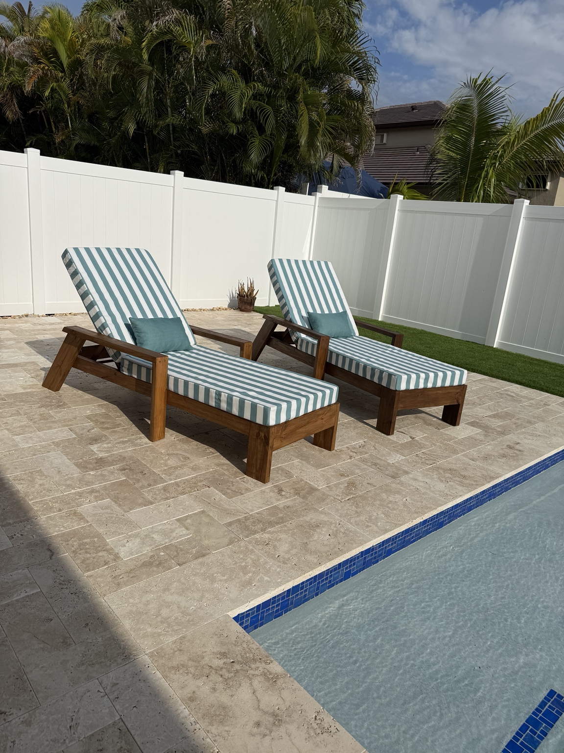 Sol loungers styled with striped cushions